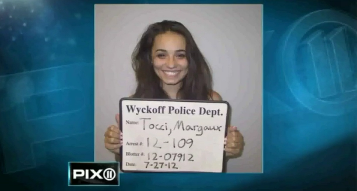 Cheerleader Sets Up Ex-Boyfriend And Smiles Hard In Mugshot!